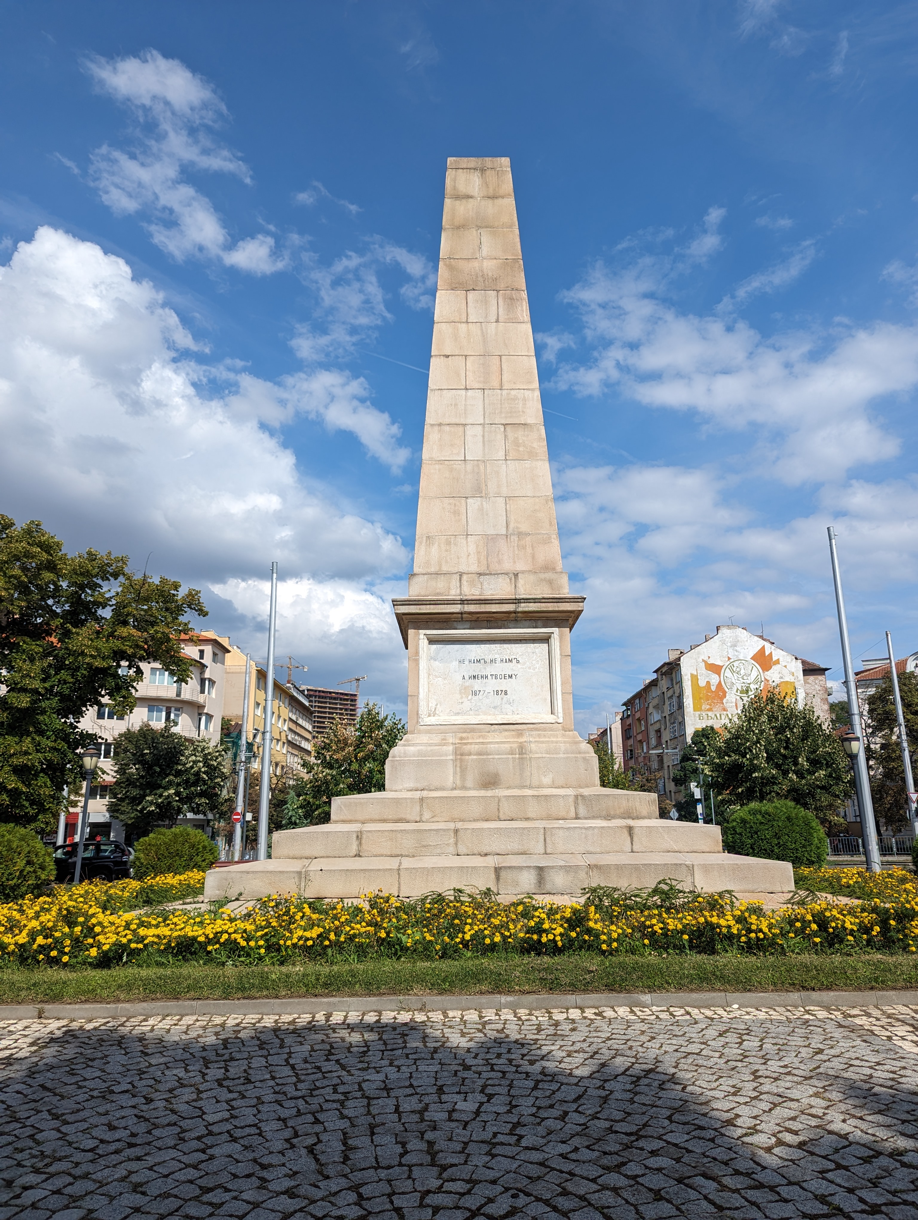 Monument base with sculptures